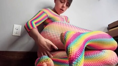 Teen in Rainbow Fishnets Fingers Herself