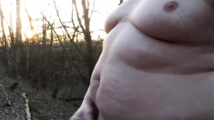 Chubby masturbates in the woods